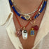 Double Pierced Shell Charm with Malaya Garnet